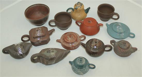 Ten Yixing pottery teapots and covers, two cups and a bowl, 20th century, 5.8cm